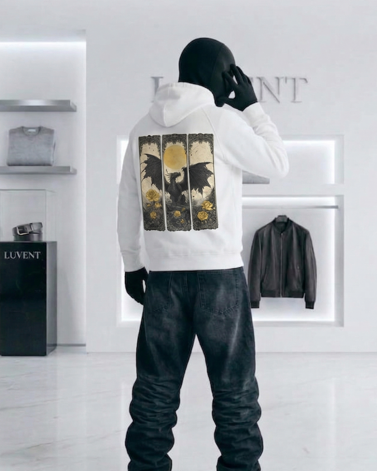 Person wearing a white hoodie with graphic design in a modern store setting