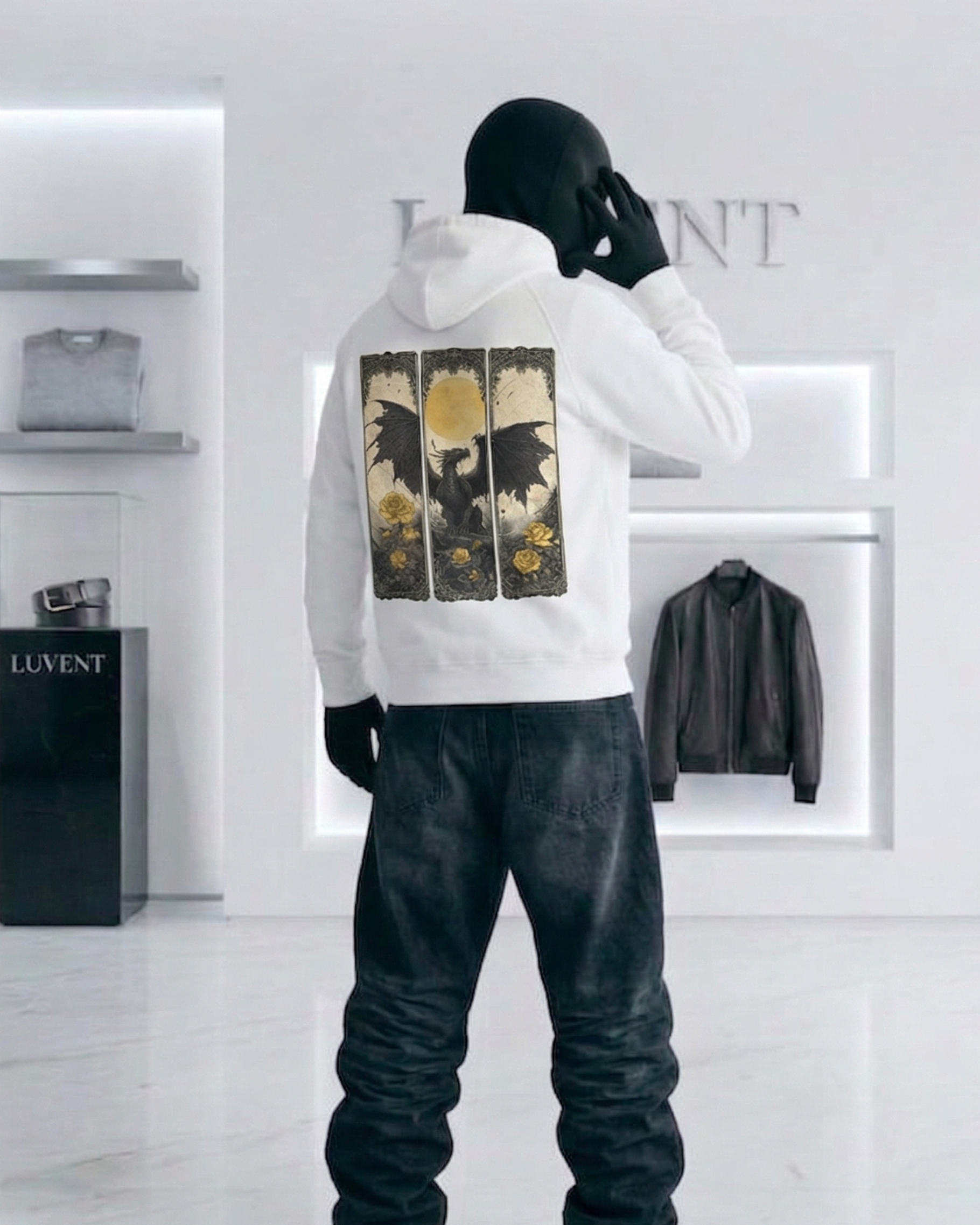 Person wearing a white hoodie with graphic design in a modern store setting